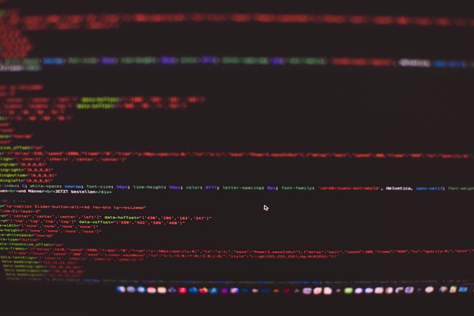 A close-up of a computer screen displaying colorful lines of code with various HTML and CSS elements visible, including color-coded text such as red, green, blue, and purple, highlighting the structur