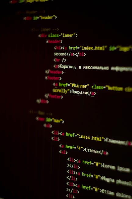 The image depicts a close-up view of a computer screen displaying colorful lines of programming code. The code features syntax highlighted in various colors, including green, orange, blue, and purple,